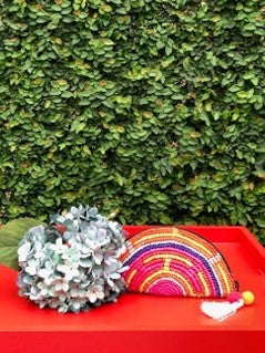 Small half-moon colorful crochet purse crafted with toquilla straw