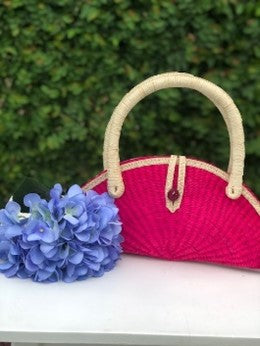 Medium-sized half-moon toquilla straw purse with reinforced toquilla handles.